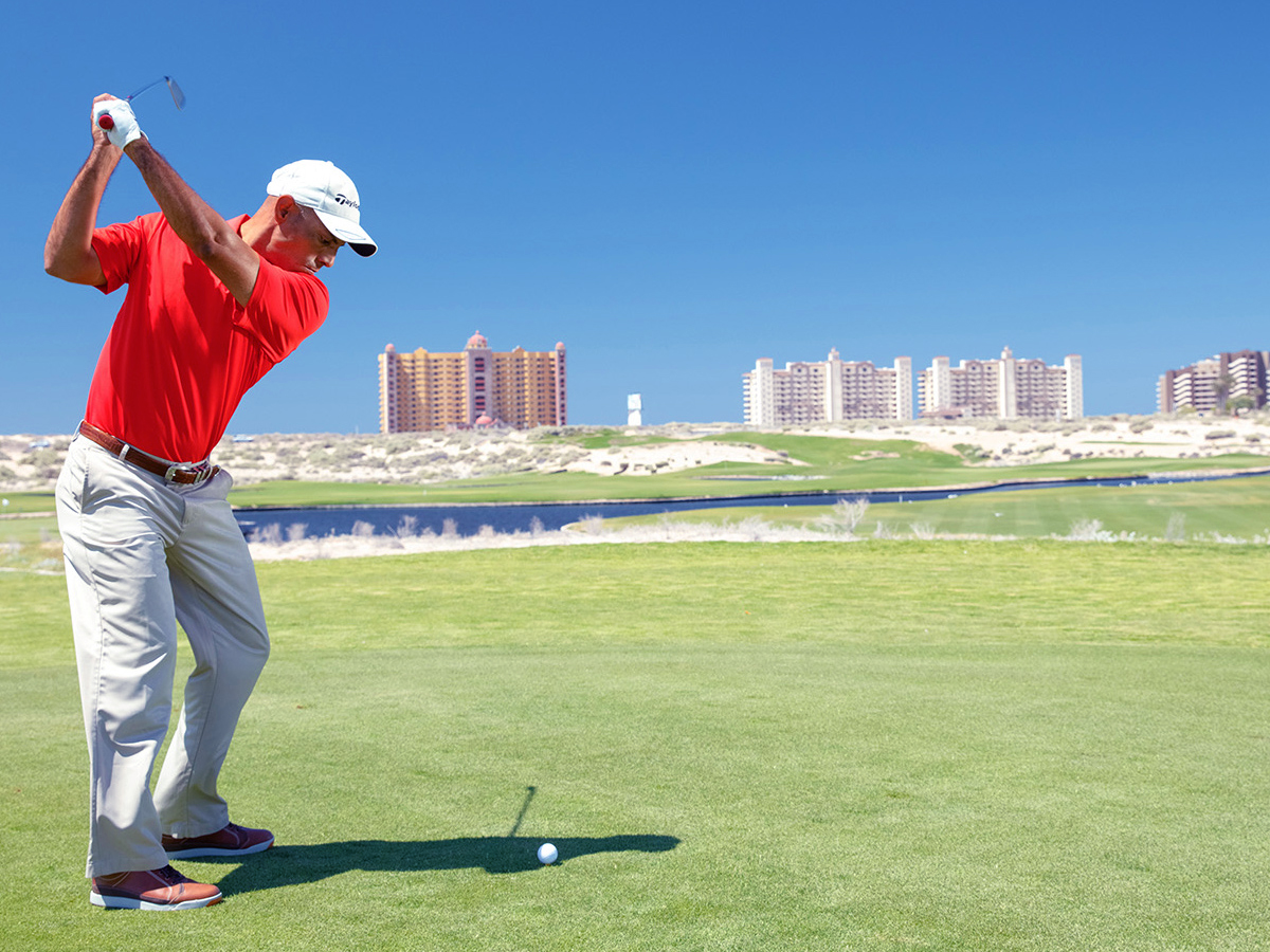 image of golfer teeing off