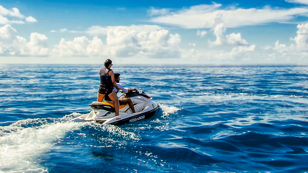 image of a couple jet skiing