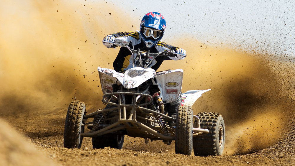 image of a guy riding a quad runner