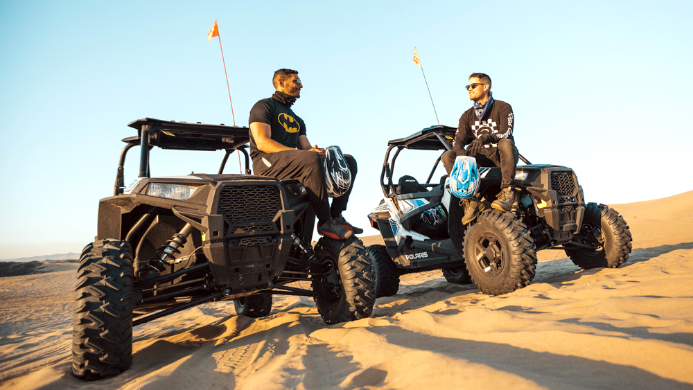 image of two guys riding their Rzrs
